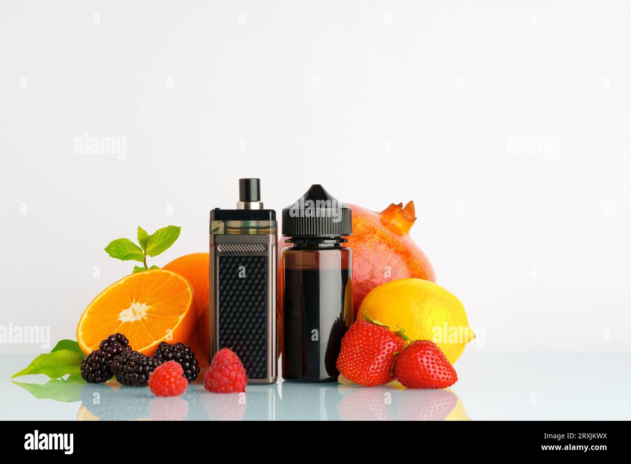 Vape and smoking liquid with fruit flavor on white background Stock Photo -  Alamy