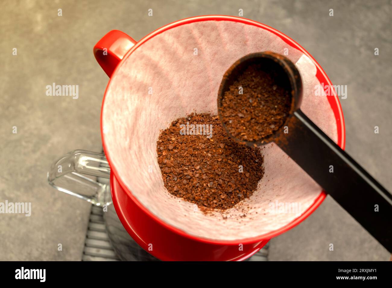 Serves coffee with a V60 dripper coffee maker on the table Stock Photo