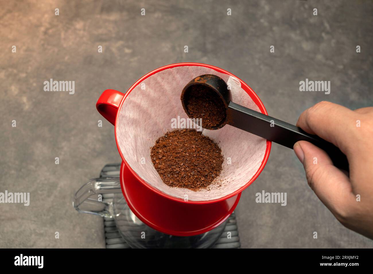 Serves coffee with a V60 dripper coffee maker on the table Stock Photo