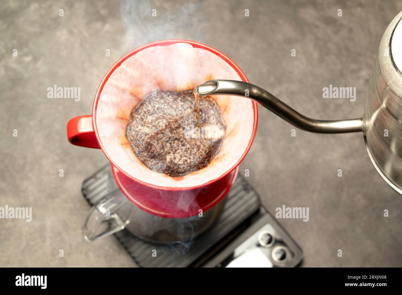 Serves coffee with a V60 dripper coffee maker on the table Stock Photo