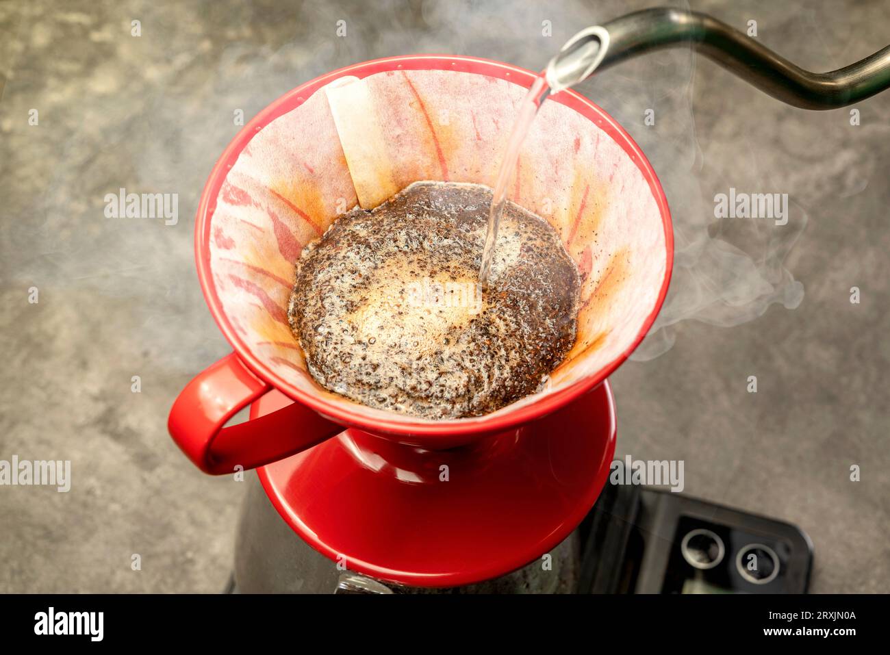Serves coffee with a V60 dripper coffee maker on the table Stock Photo