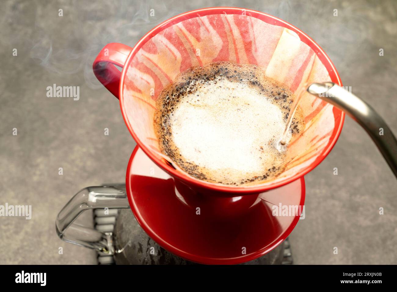 Serves coffee with a V60 dripper coffee maker on the table Stock Photo
