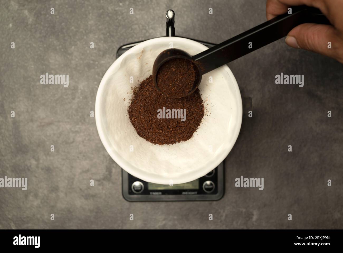 Serves coffee with a V60 dripper coffee maker on the table Stock Photo