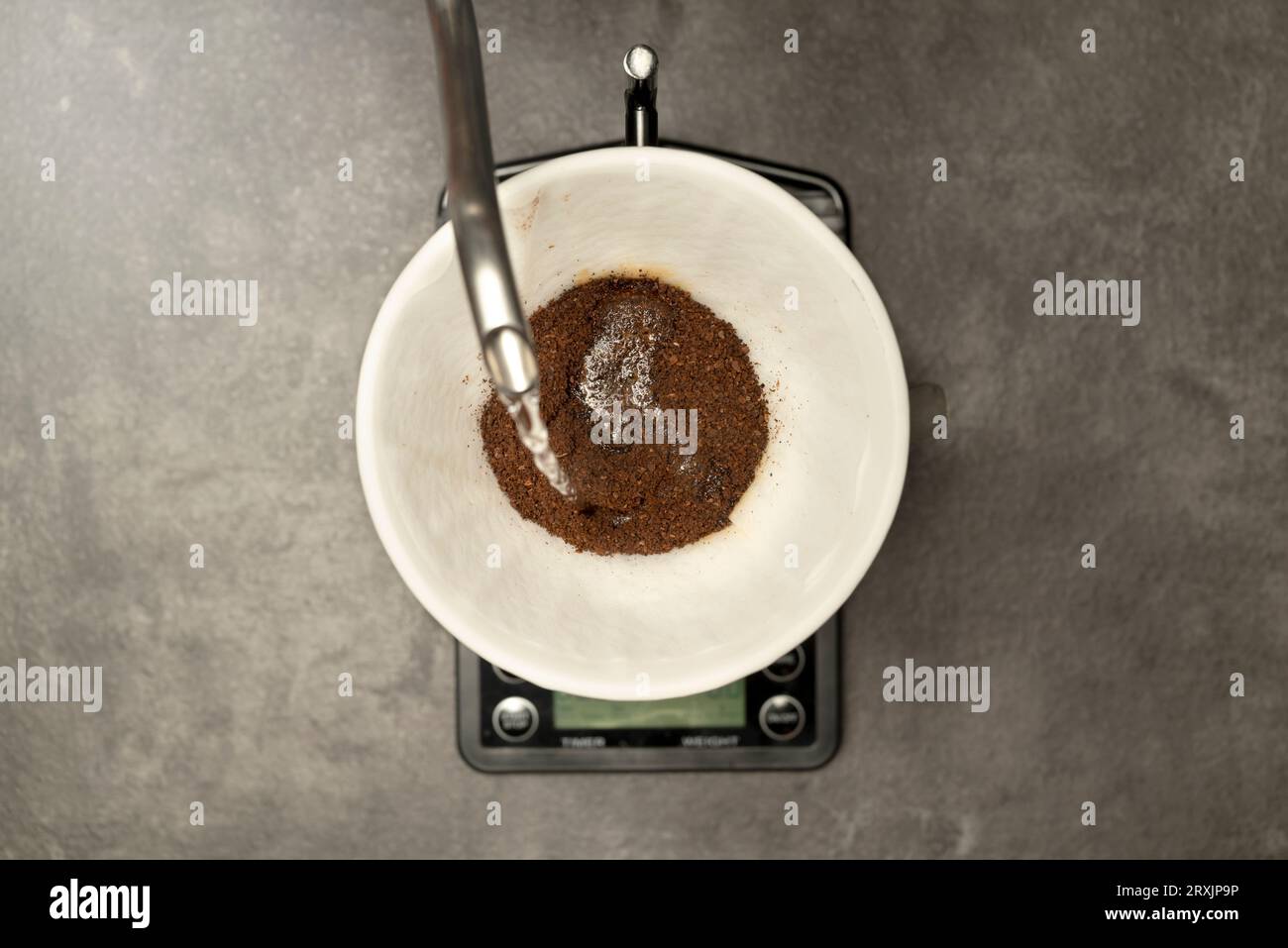 Serves coffee with a V60 dripper coffee maker on the table Stock Photo