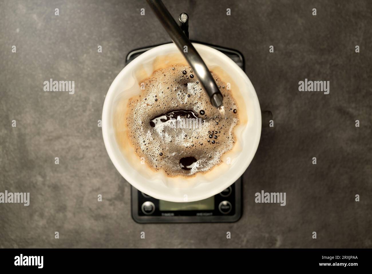 Serves coffee with a V60 dripper coffee maker on the table Stock Photo