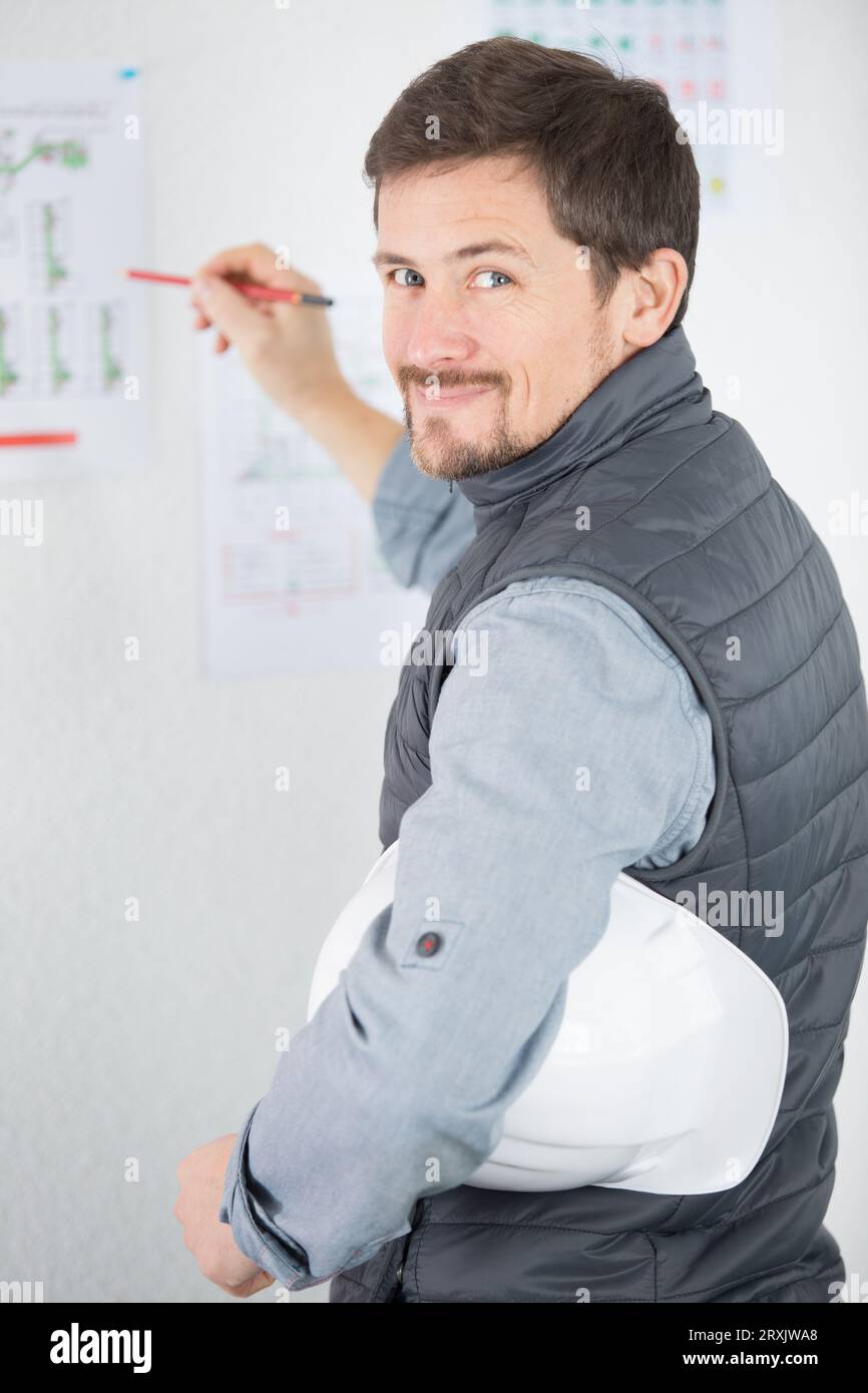 architect working on blueprint plans Stock Photo