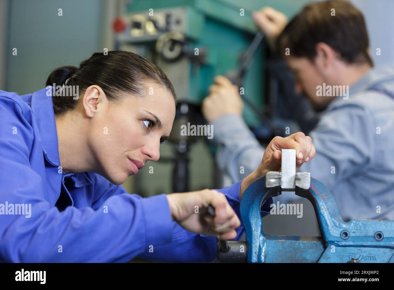 confident young worker in factory Stock Photo
