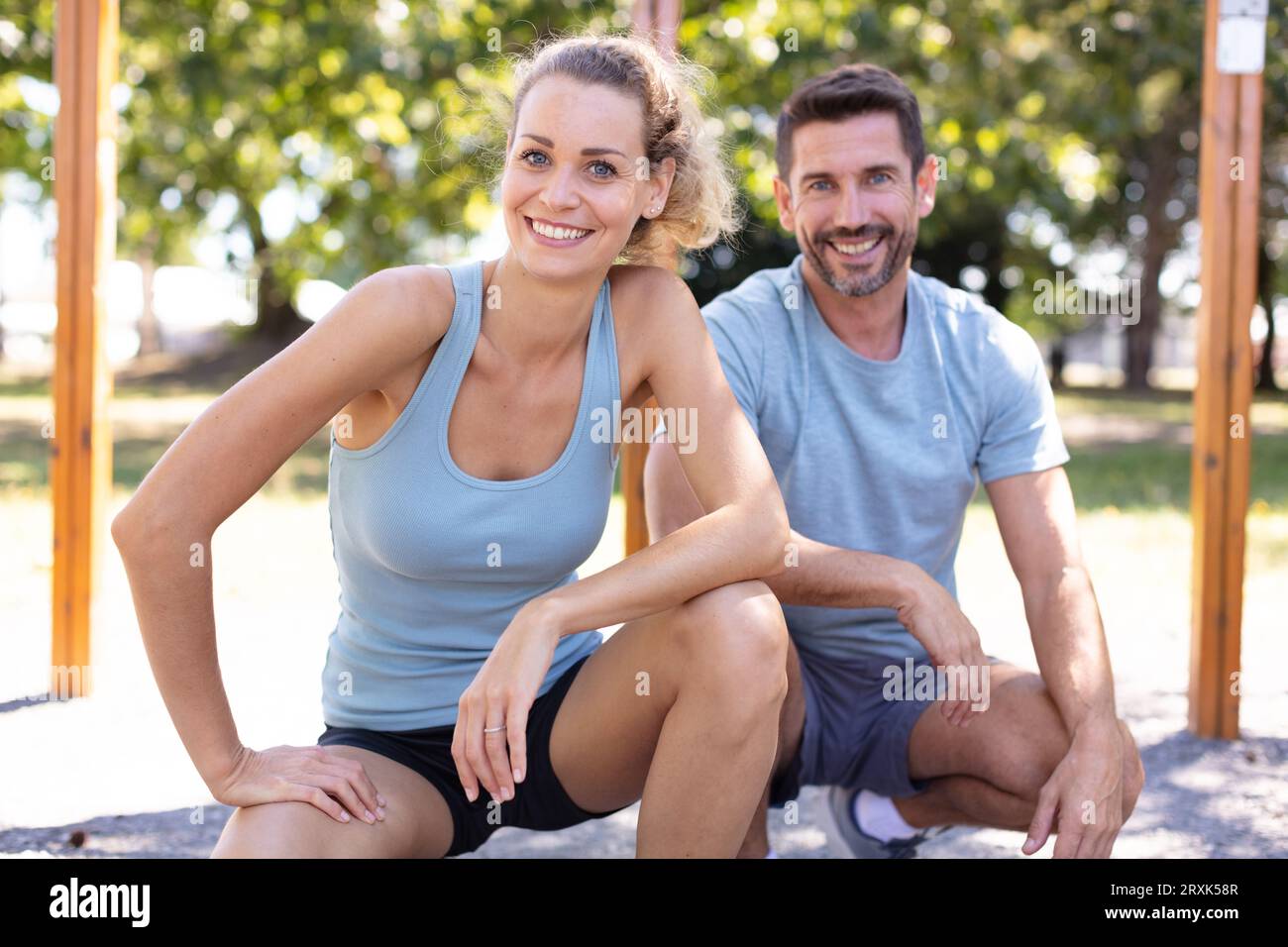 couple stretching after doing exercises Stock Photo