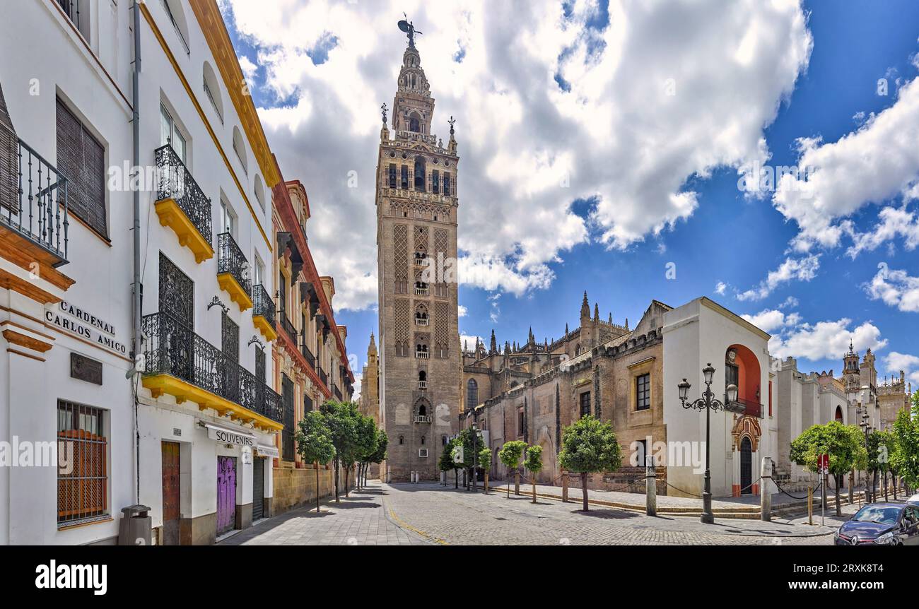 Giralda tower standing against clouds, Seville, Andalusia, Spain Stock Photo