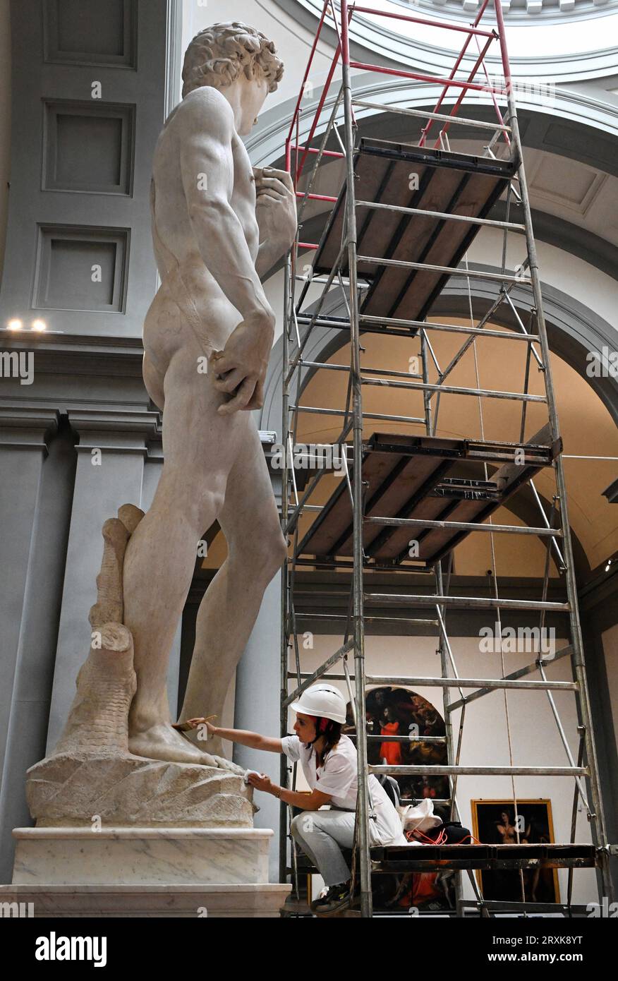 Italian Restorer Eleonora Pucci cleans dust and debris off Michelangelo ...
