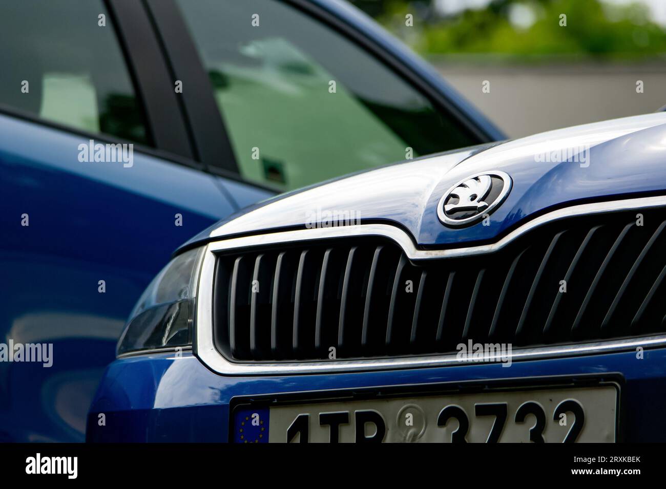 OSTRAVA, CZECH REPUBLIC - JULY 17, 2023:  Detail of blue Skoda Rapid, its badge, grill and hood Stock Photo