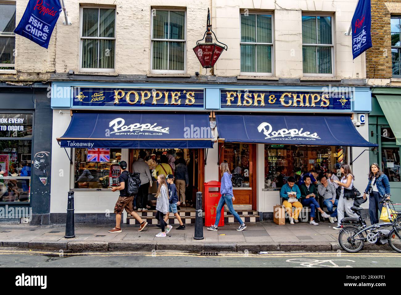 People buying fish and chips at Poppies Fish & Chip shop Spitalfields,London E1 Stock Photo