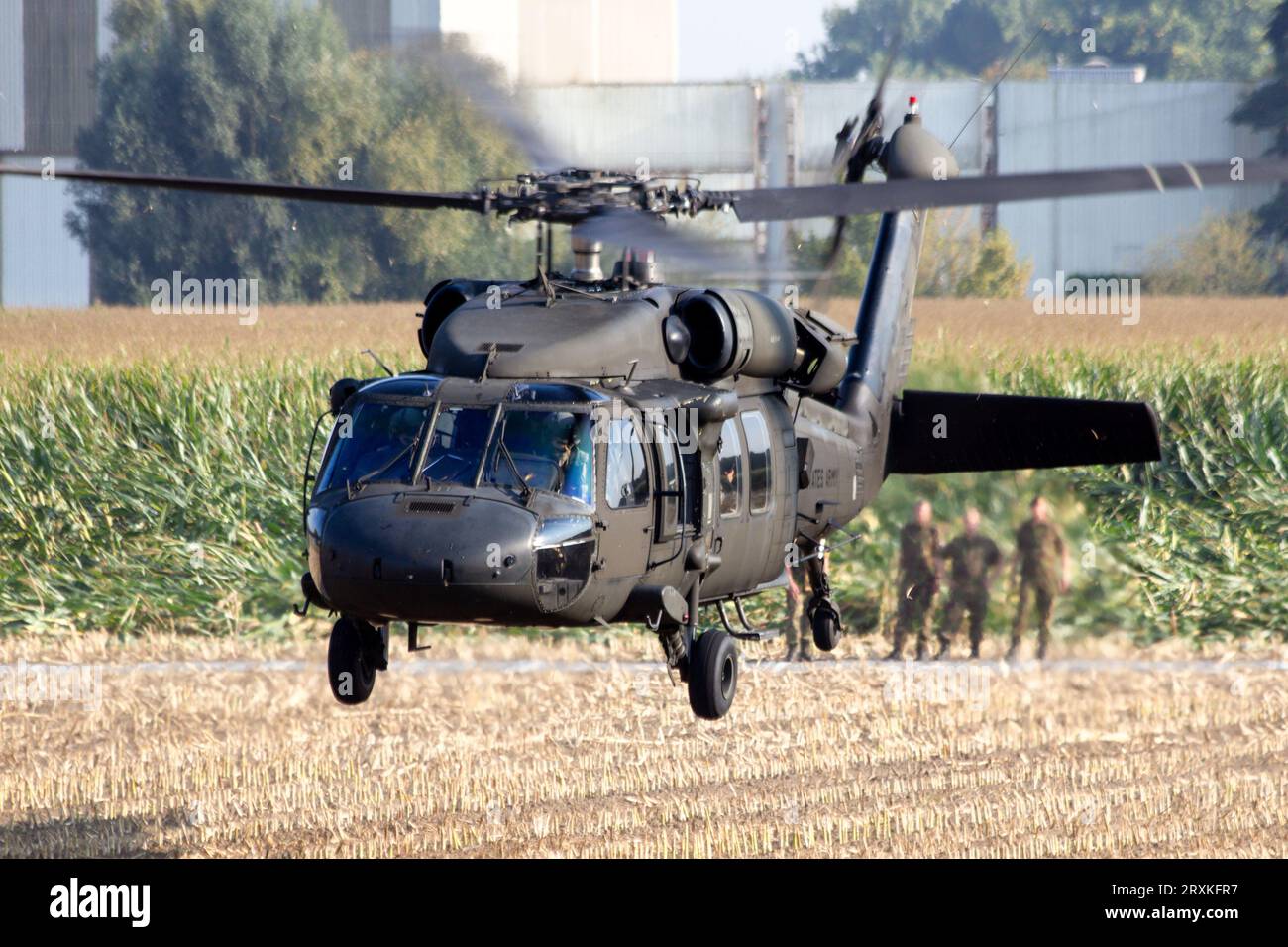 US Army UH60 Black Hawk helicopter departing at a landing zone. Grave