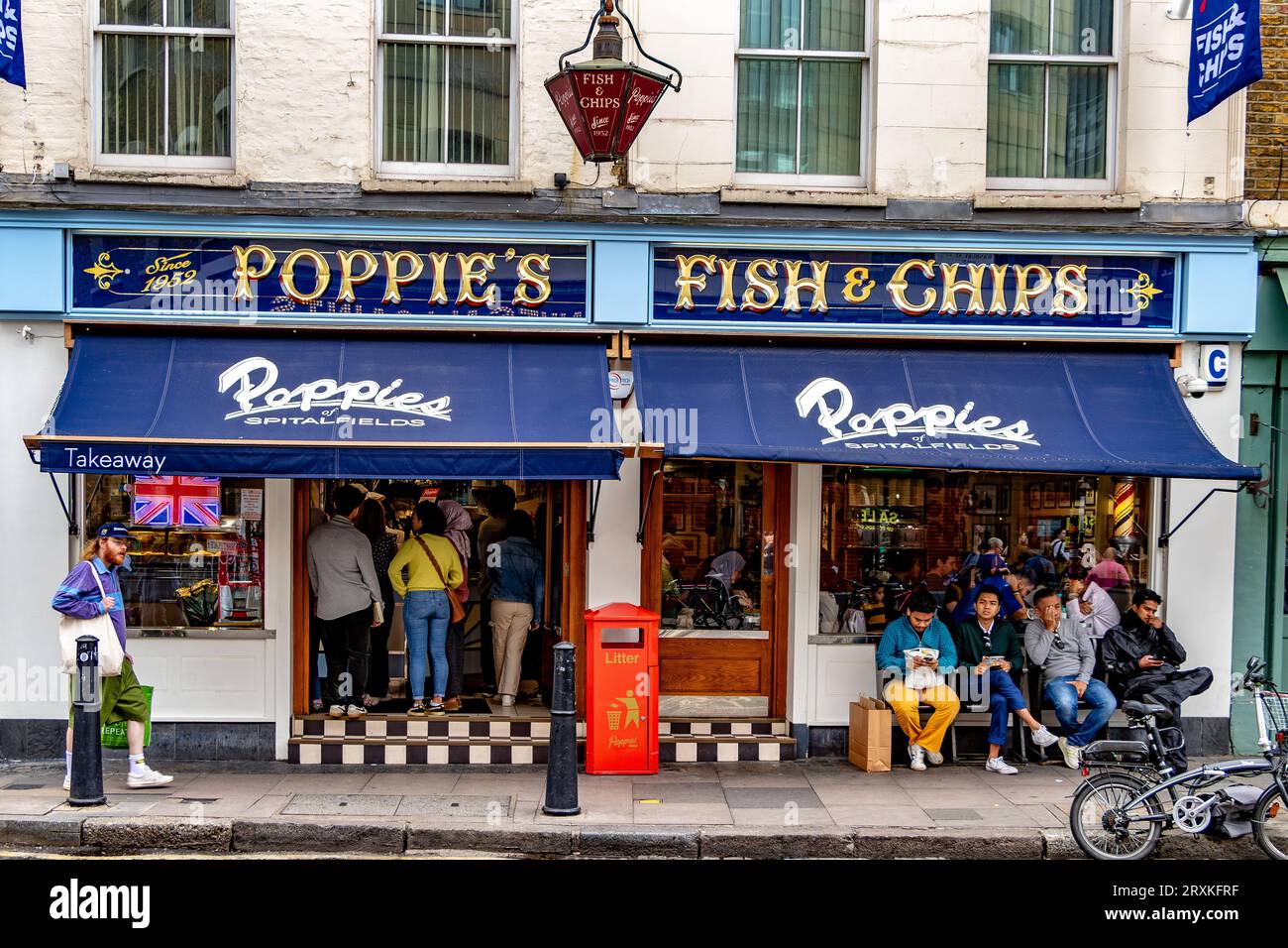 People buying fish and chips at Poppies Fish & Chip shop Spitalfields,London E1 Stock Photo