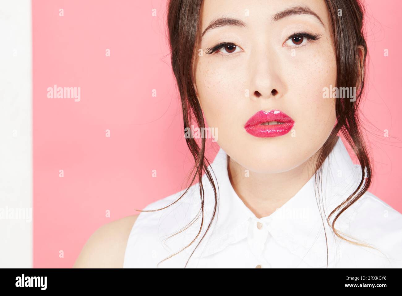 Young woman wearing pink lipstick Stock Photo