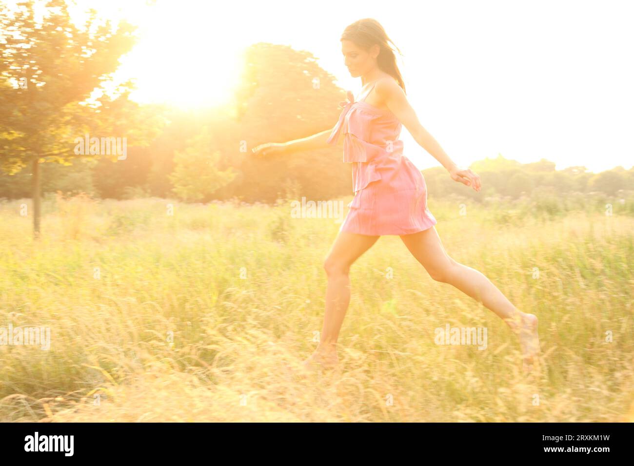 Woman in pink beautiful dress hi-res stock photography and images - Alamy