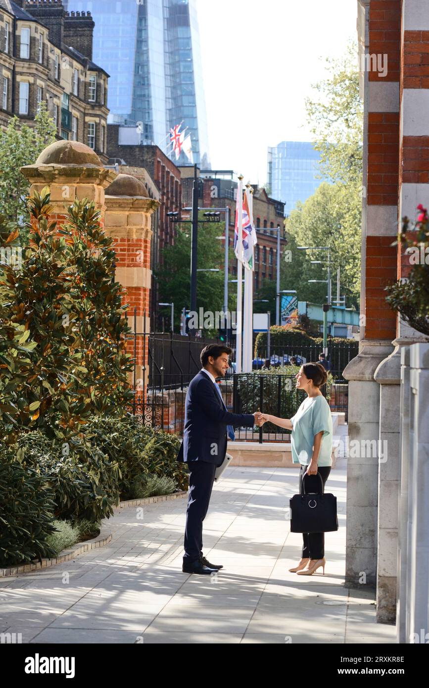 Businesspeople shaking hands Stock Photo