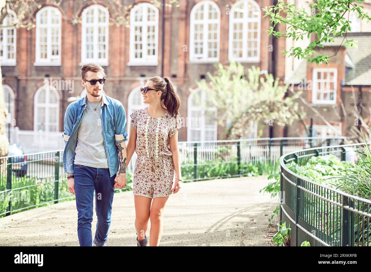 Two teen boys holding hands hi-res stock photography and images - Alamy