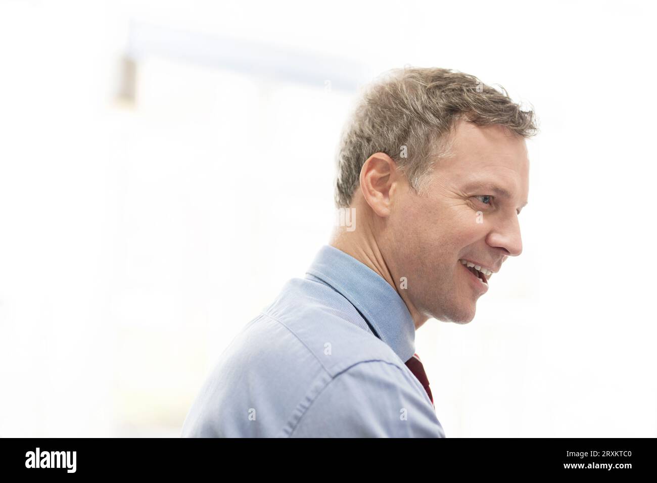 Mature businessman talking during office meeting Stock Photo