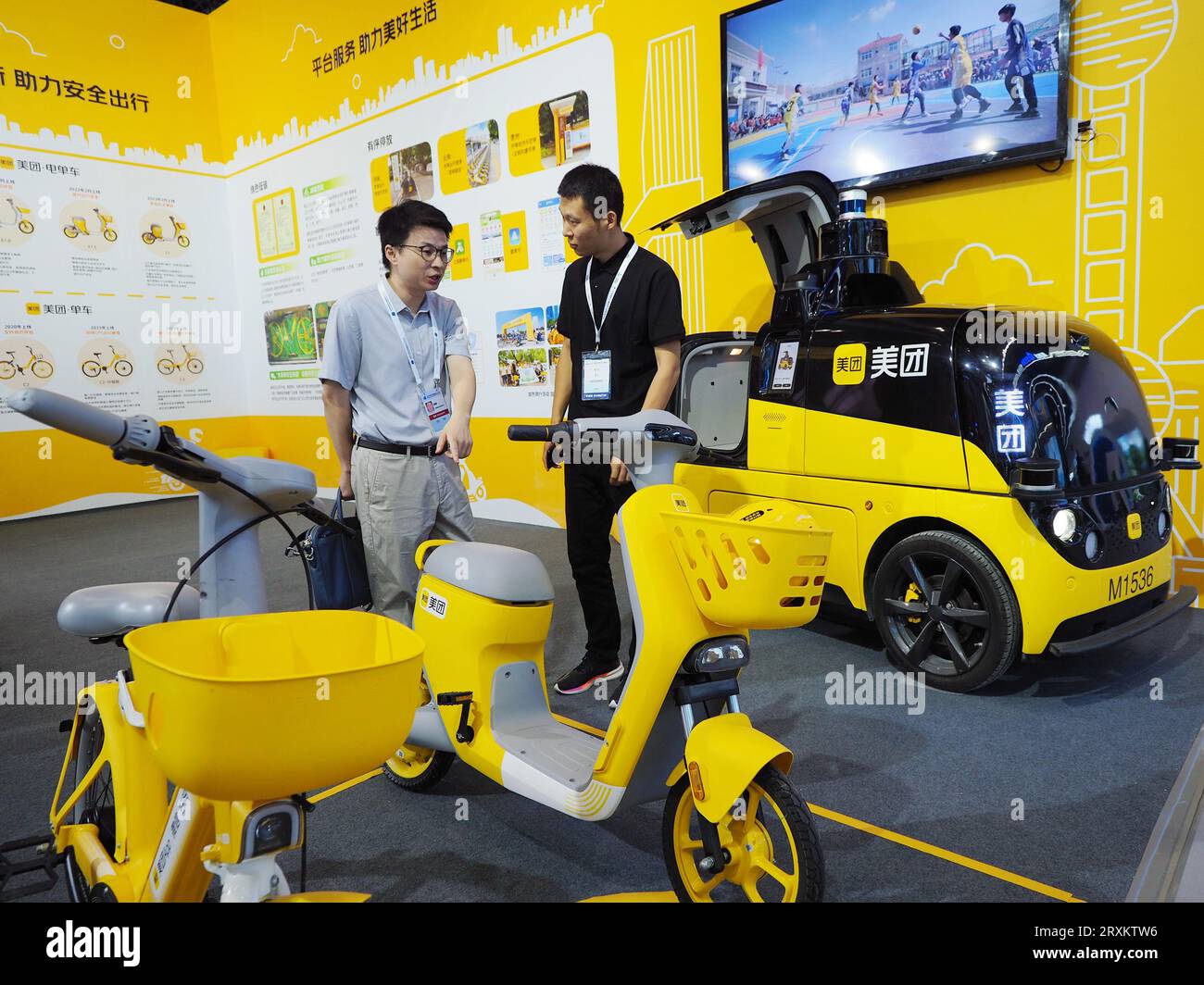 BEIJING, CHINA - SEPTEMBER 26, 2023 - Visitors visit the booth of Meituan at the 15th International Transportation Technology and Equipment Exhibition Stock Photo