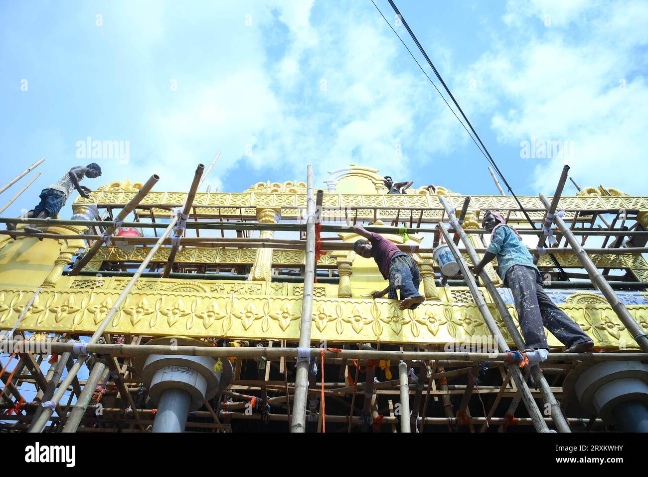 Workers are making a pandal, a temporary structure set up to usually venerate the God and Goddess, ahead of Ganesh Chaturthi festival in Agartala. Tripura. India. Stock Photo