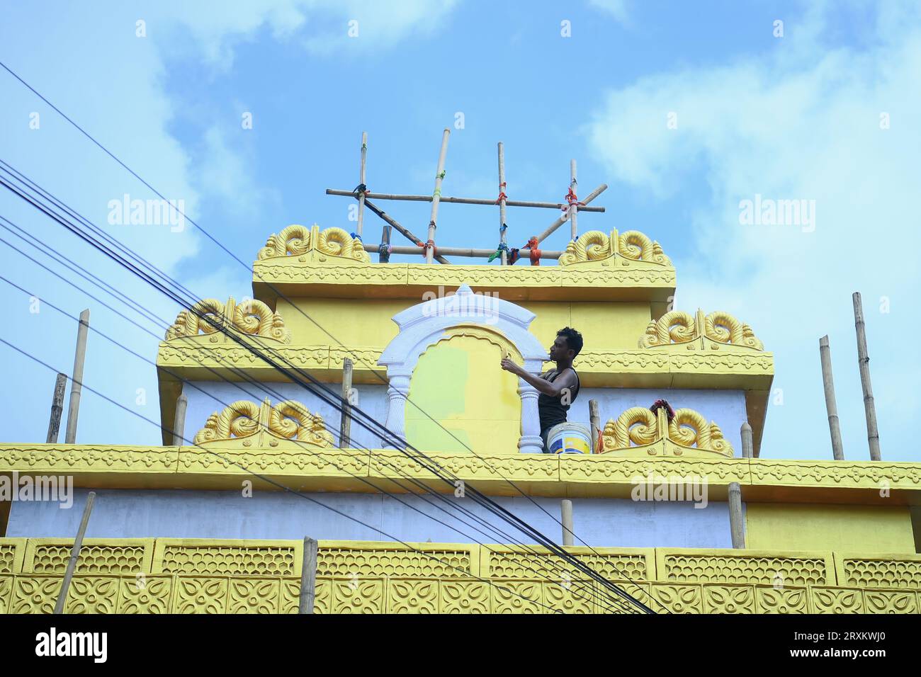 Workers are making a pandal, a temporary structure set up to usually venerate the God and Goddess, ahead of Ganesh Chaturthi festival in Agartala. Tripura. India. Stock Photo