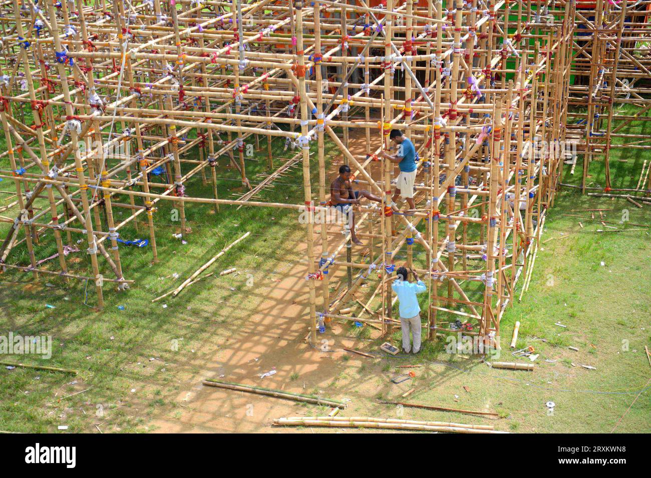 Workers are making a temporary bamboo structure, locally called 'Pandal', for the upcoming Durga Puja in Agartala. Tripura, India. Stock Photo