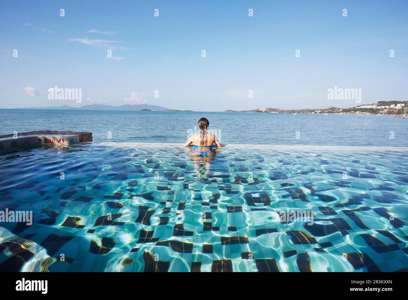 Rear view young woman swimming pool hi-res stock photography and images ...