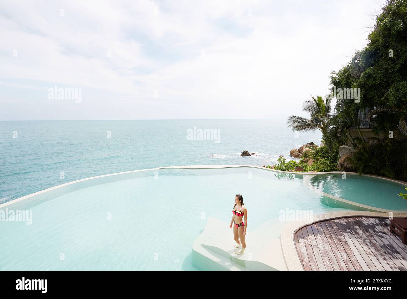 Young woman wearing red bikini in swimming pool Stock Photo - Alamy