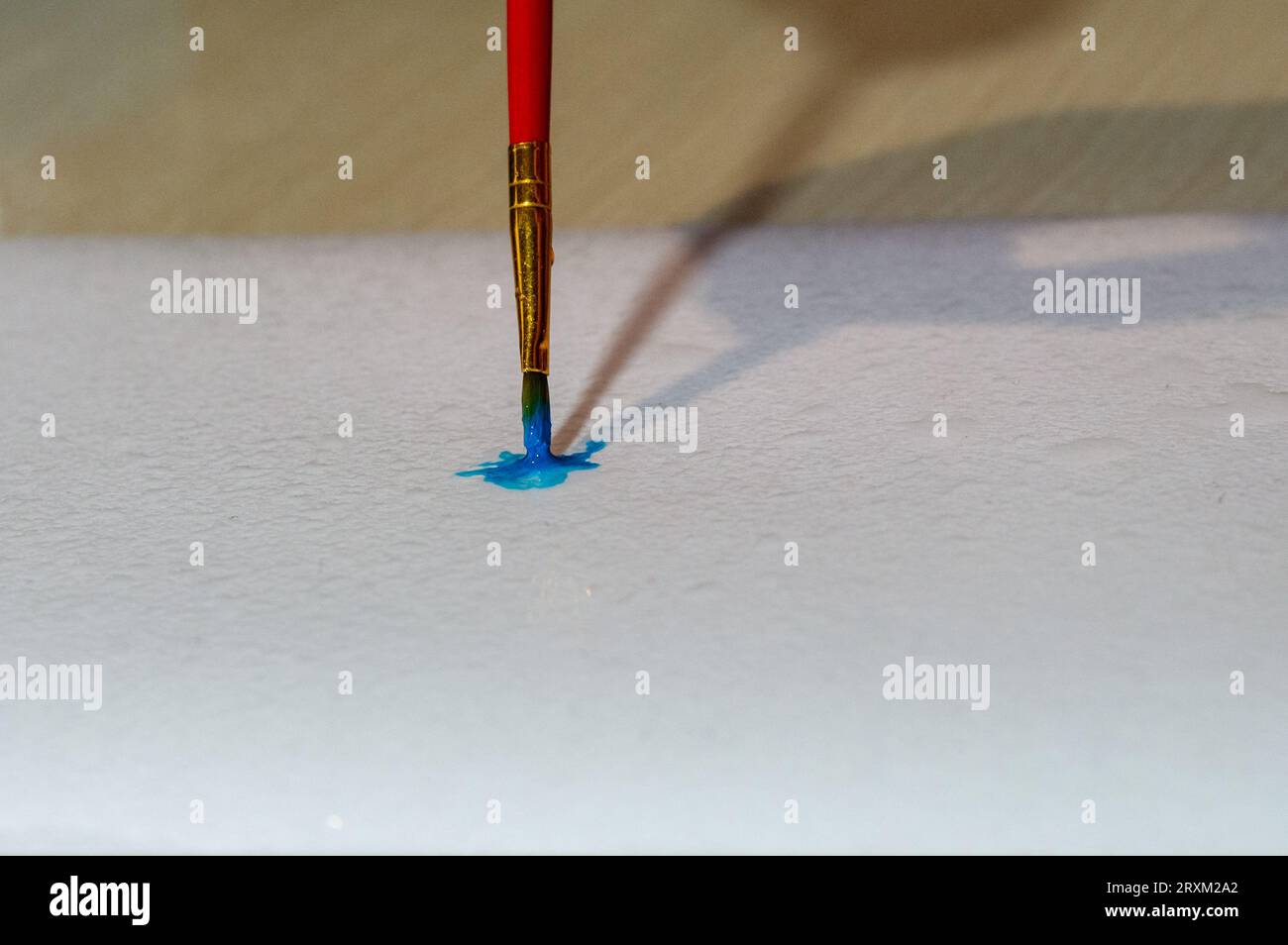 blue paint brush on paper Stock Photo
