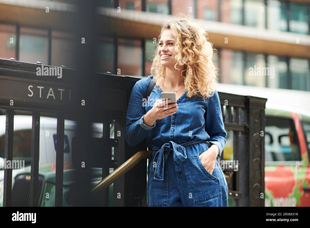Young woman holding smart phone Stock Photo