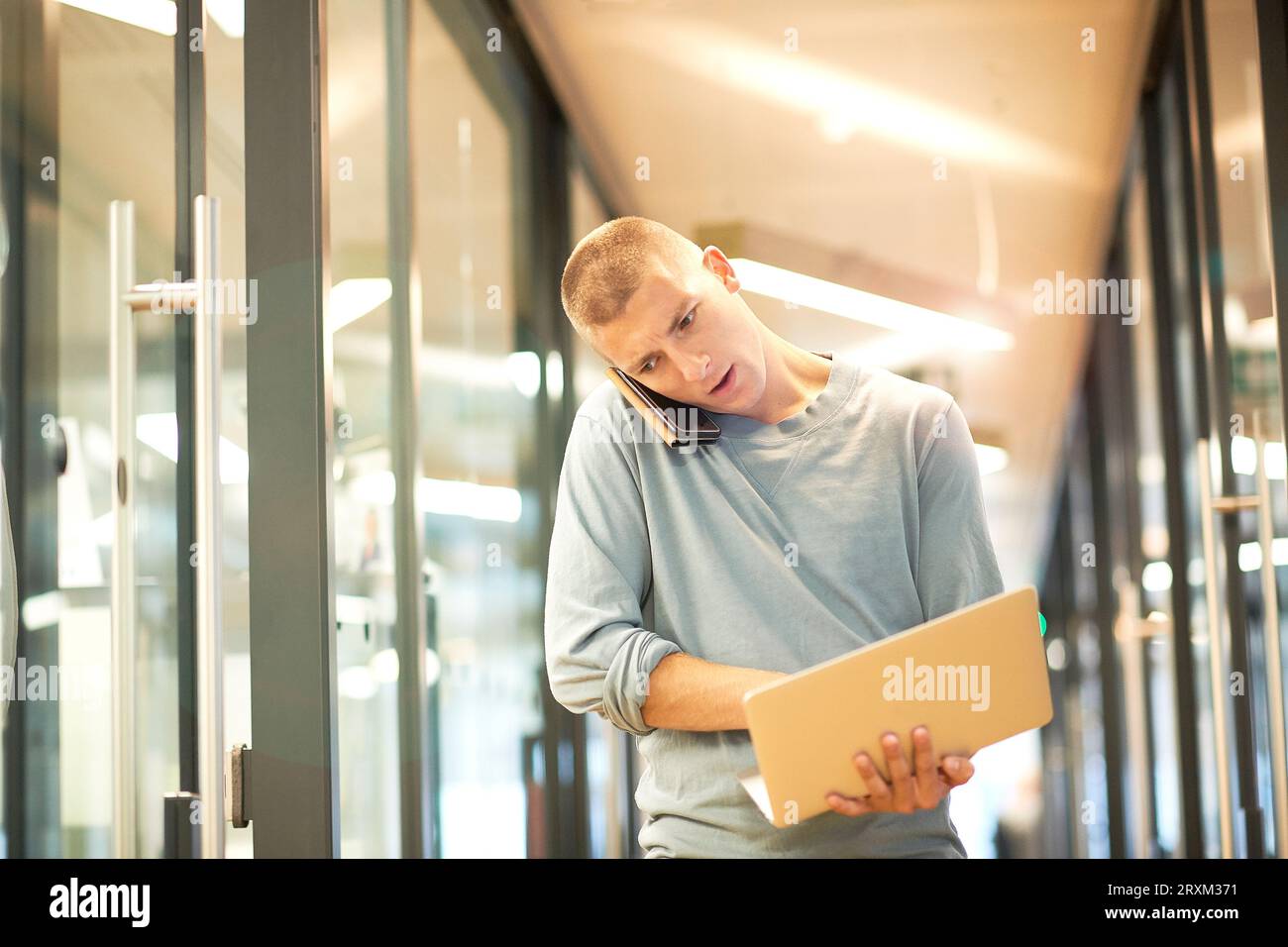 Businessman using smart phone and laptop Stock Photo