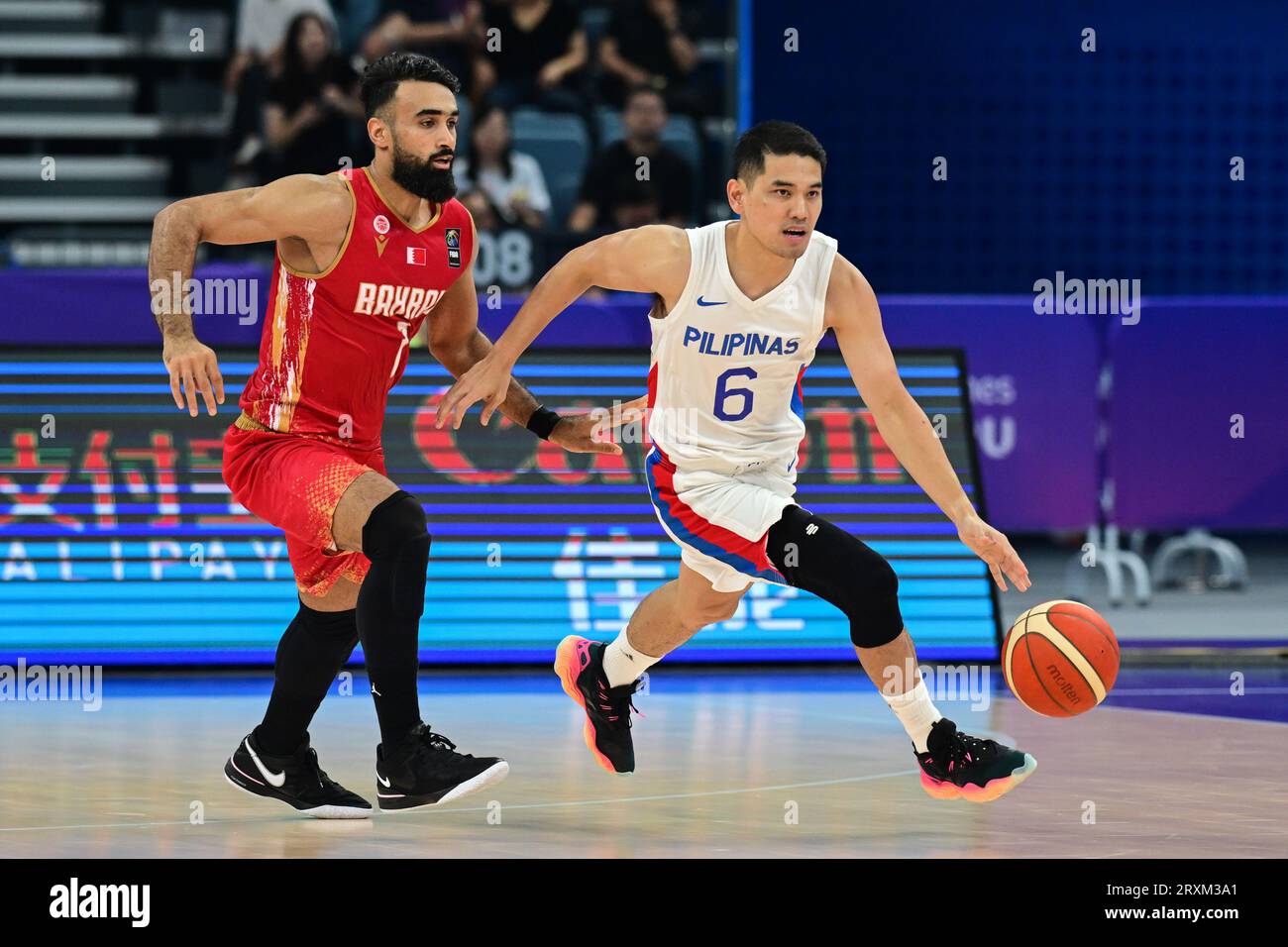 Hangzhou, China. 26th Sep, 2023. Maitham Jameel A.Mahdi Almoathin (L) of  the Bahrain men basketball team and Kevin Louie Alas (R) of the Philippine  men basketball team seen in action during the