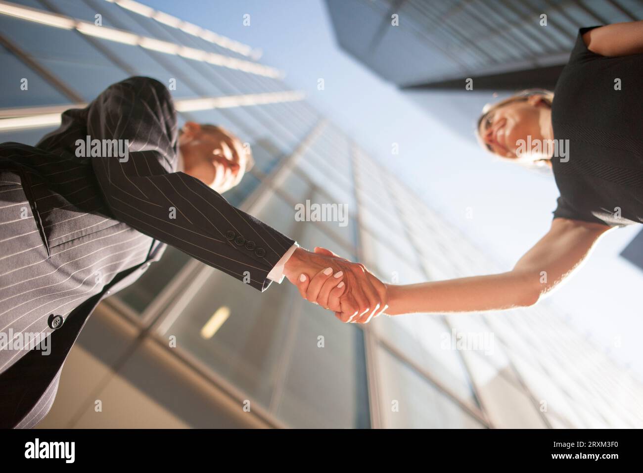 Low angle view of businesspeople shaking hands Stock Photo