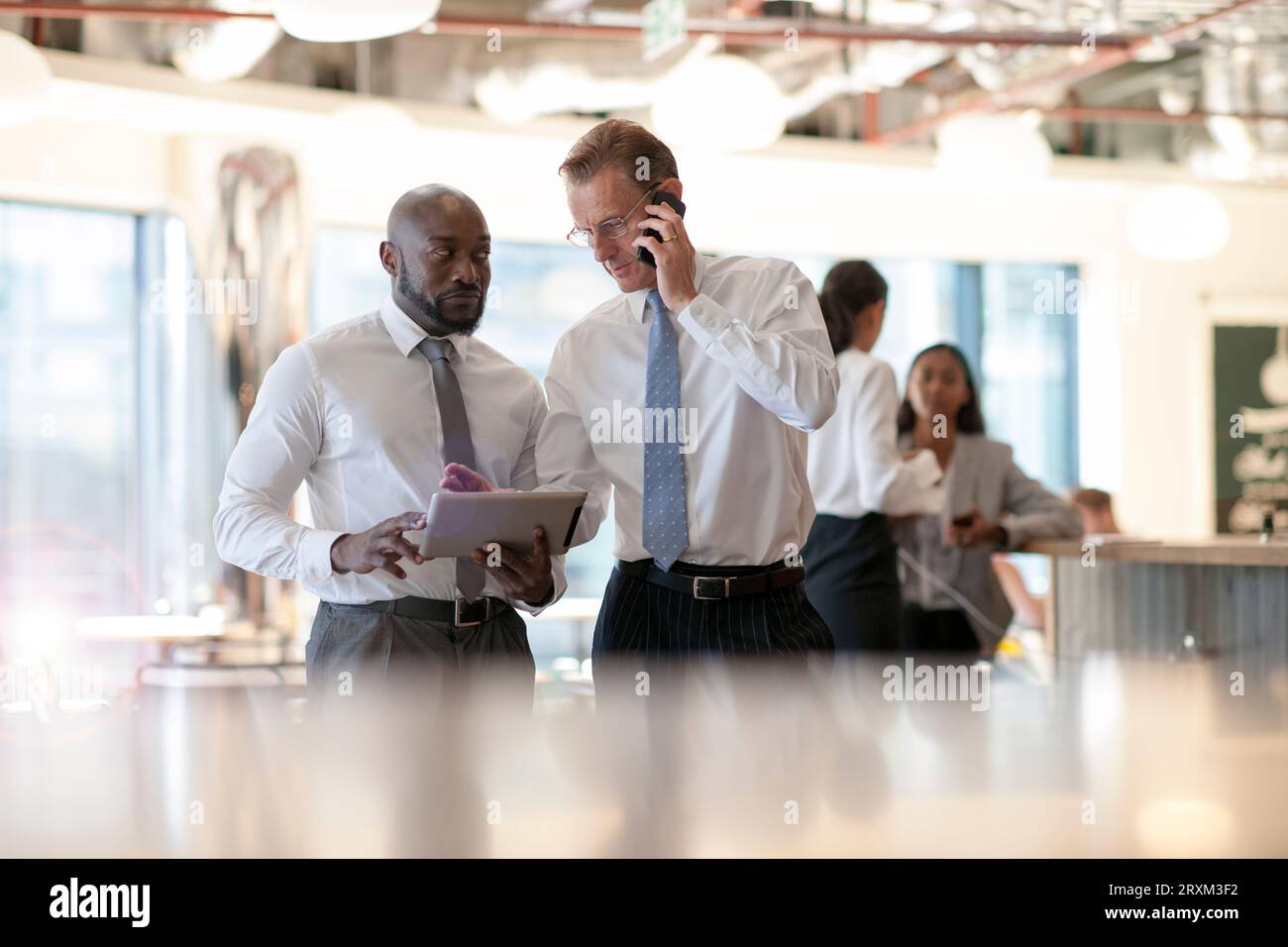 Businessmen using digital tablet and smart phone Stock Photo