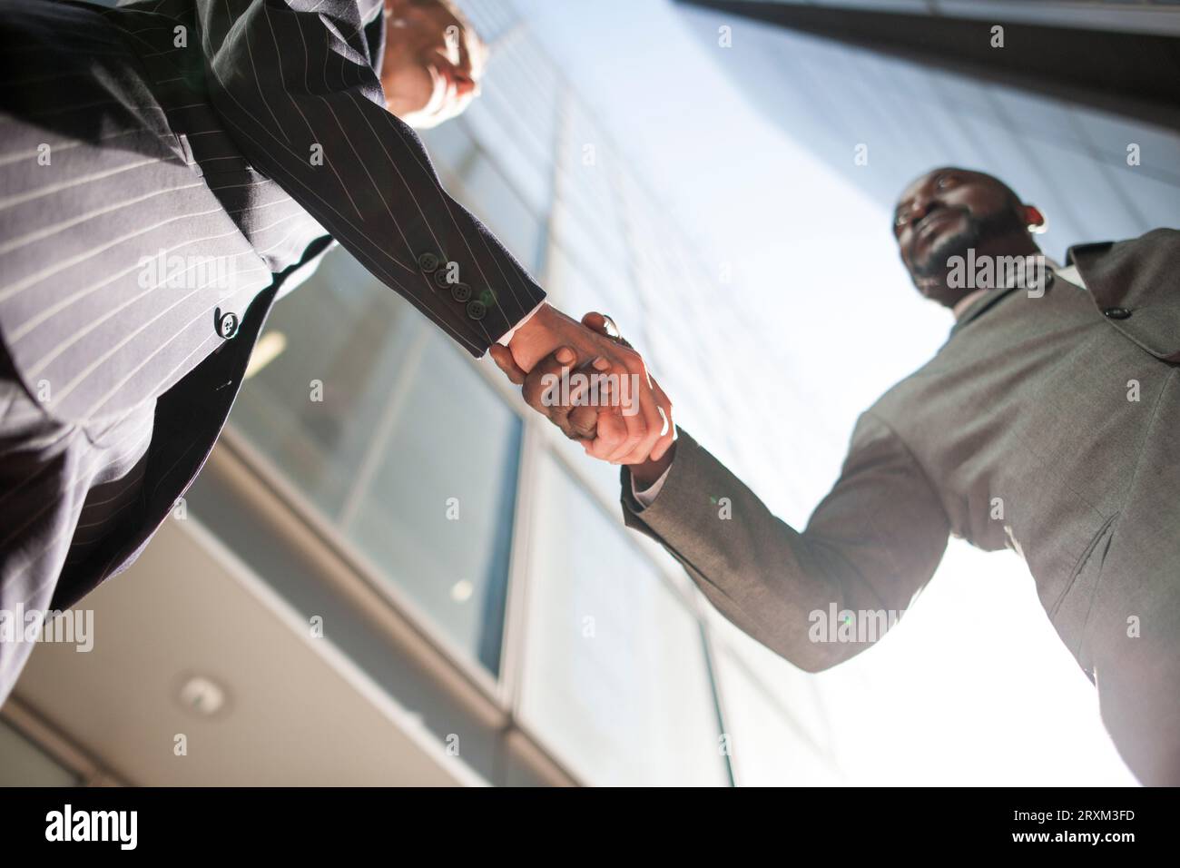 Low angle view of businessmen shaking hands Stock Photo
