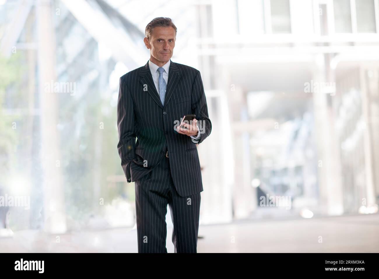 Businessman holding smart phone Stock Photo