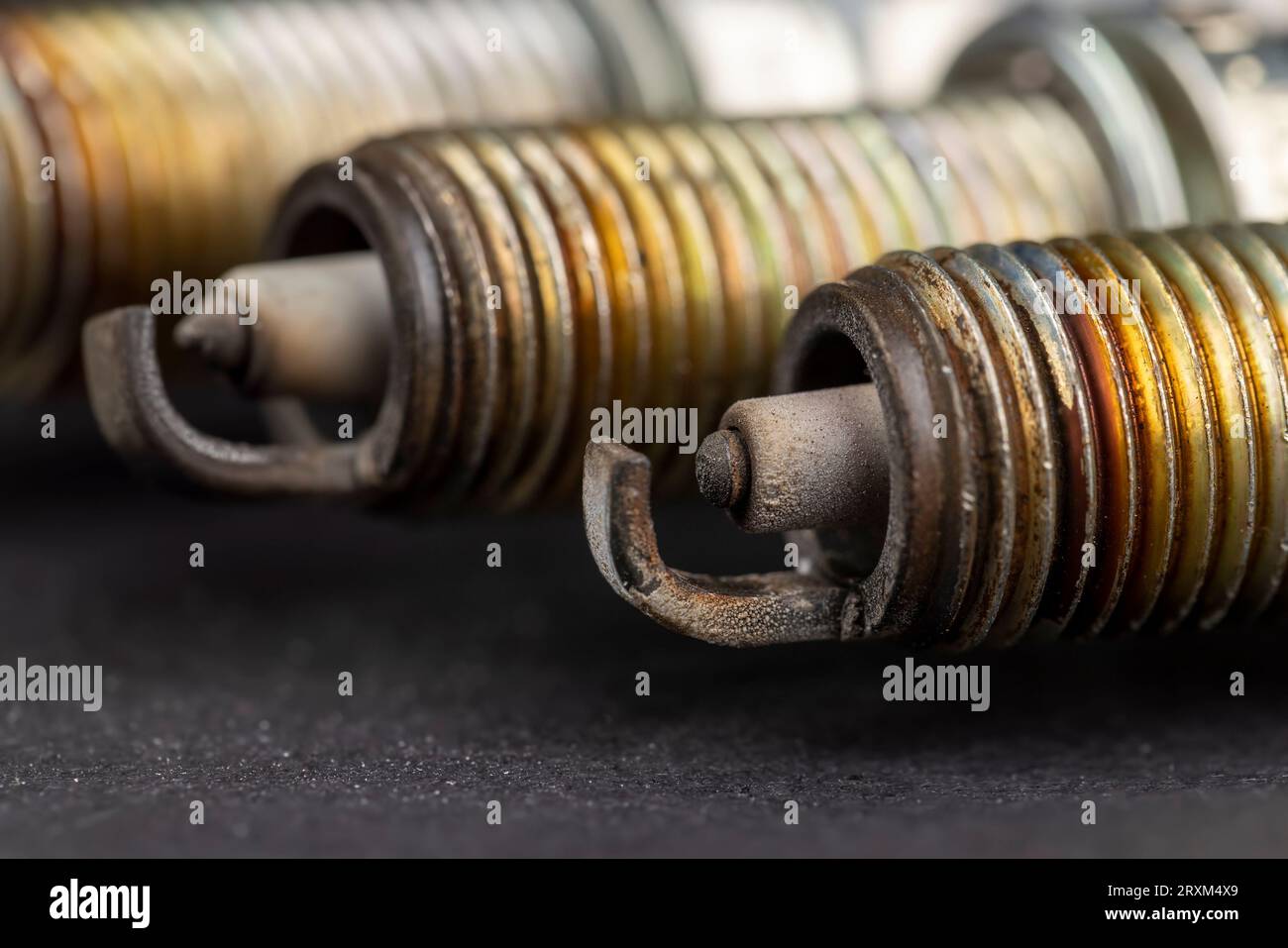 old very damaged car spark plugs, closeup of old used car spark plugs