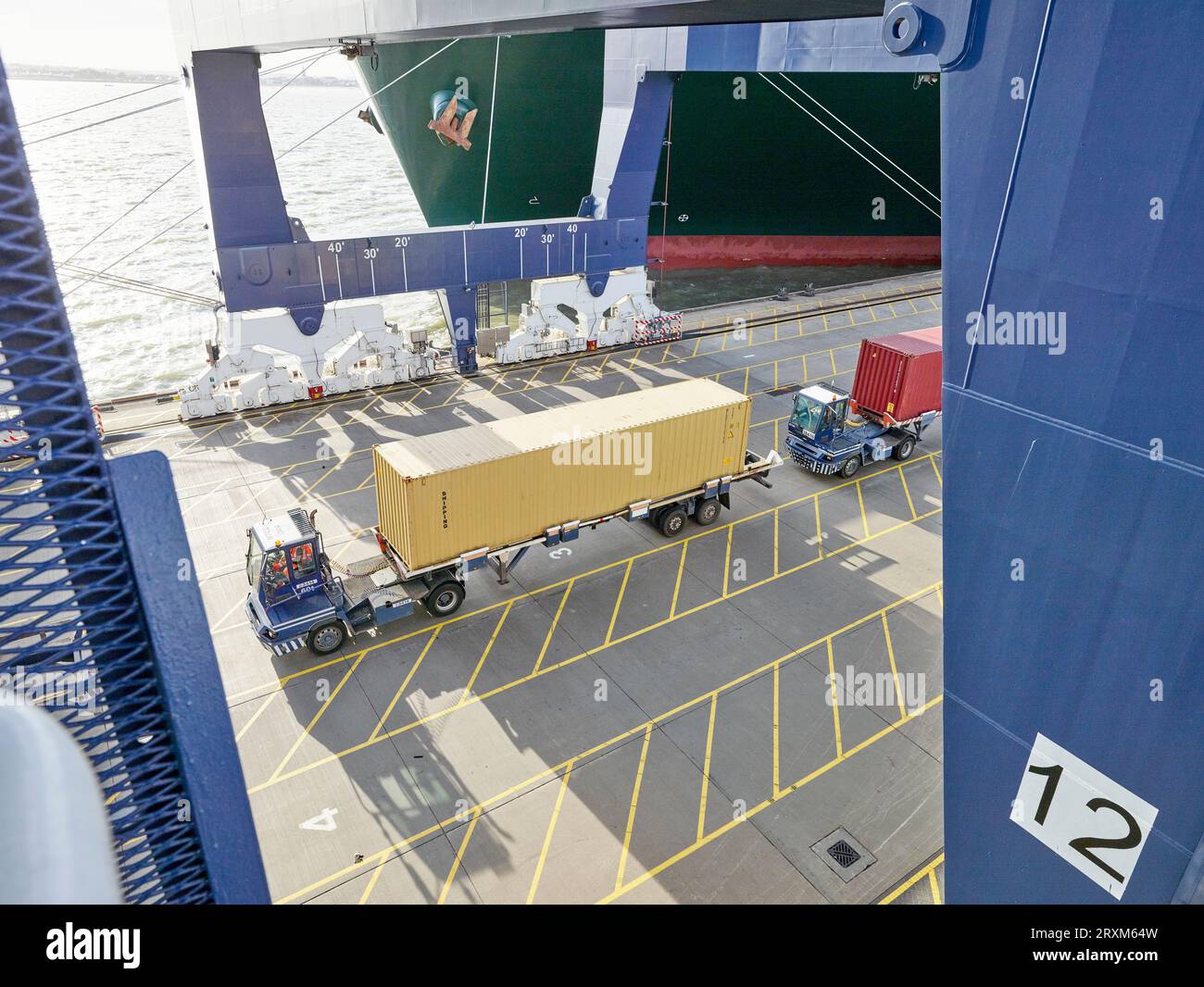Truck with cargo container driving on dock Stock Photo Alamy
