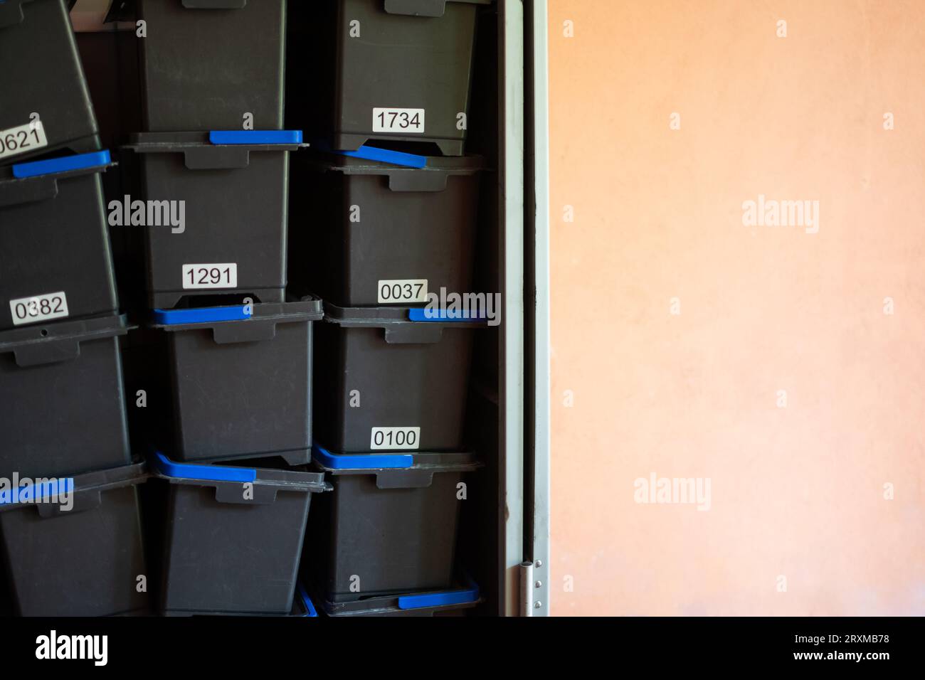 Stacked storage boxes with numbering showing order and organization in companies Stock Photo