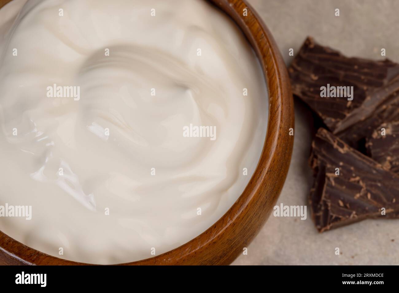 Creamy yogurt with chocolate close-up, milk yogurt from cow's milk with chocolate pieces from cocoa Stock Photo