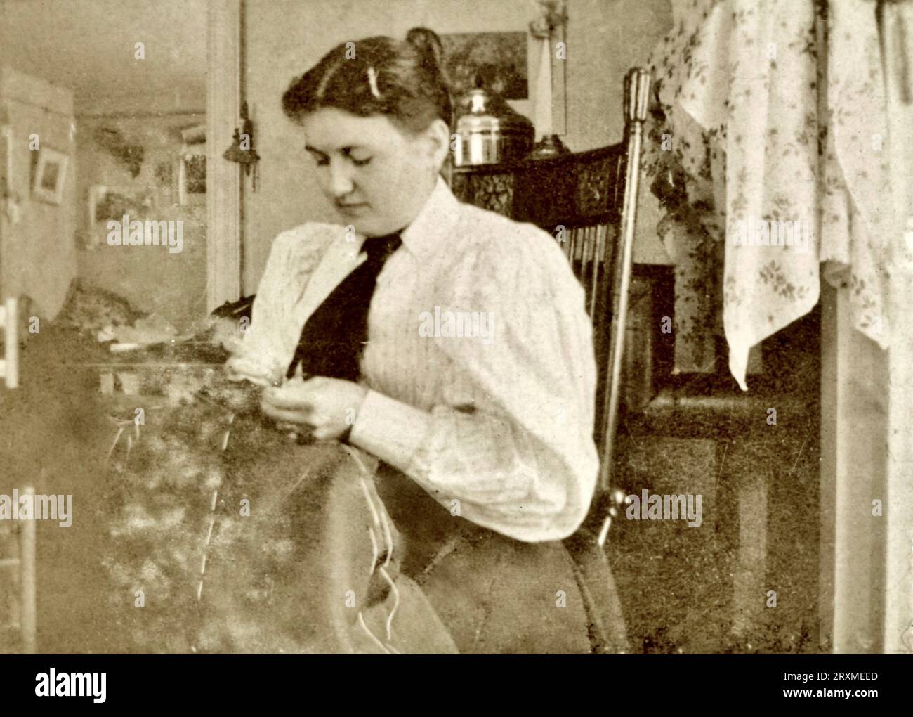 Woman Sewing about 1900 Stock Photo