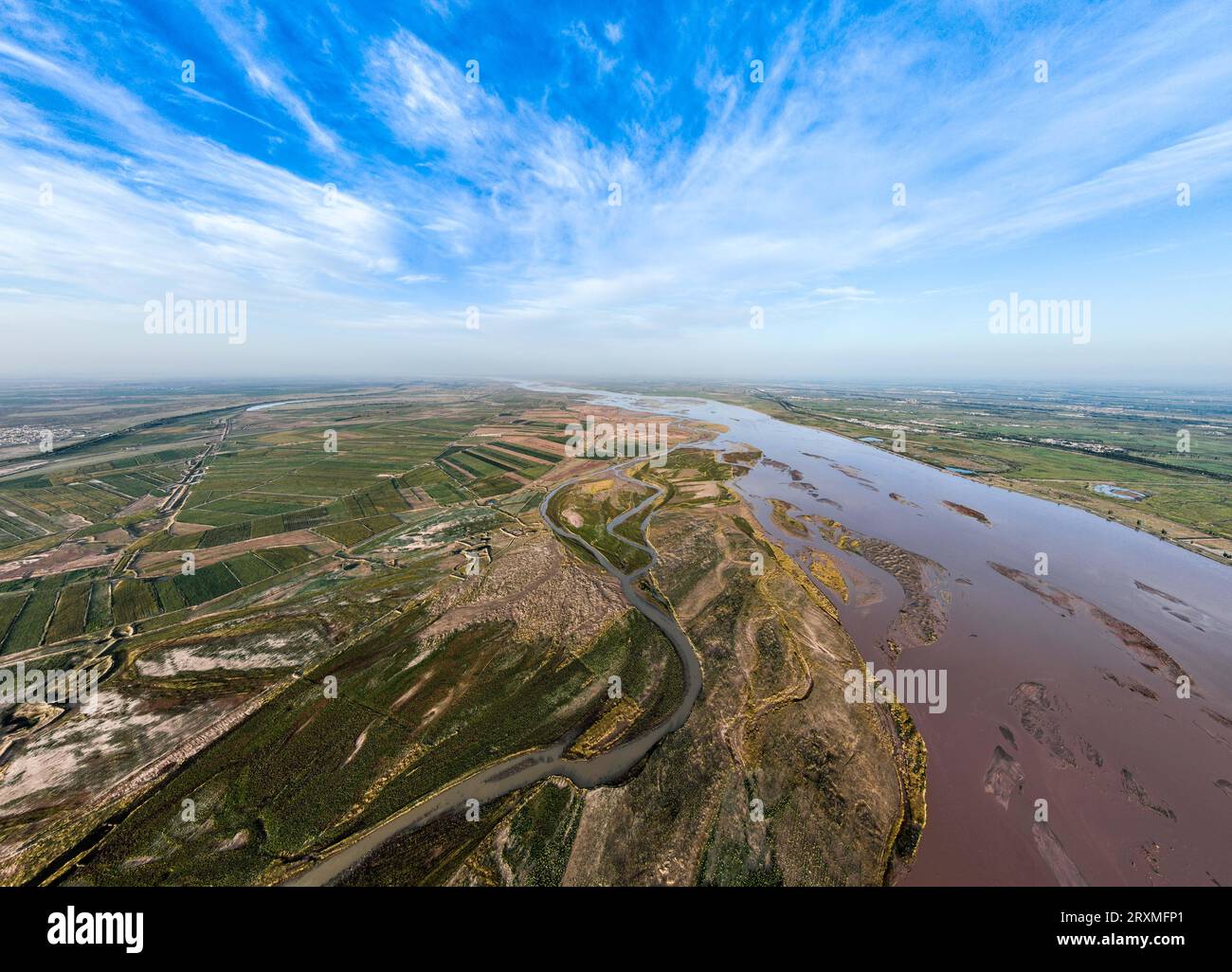(230926) -- BAYANNUR, Sept. 26, 2023 (Xinhua) -- This aerial photo taken on Sept. 15, 2023 shows a view of the Yellow River in Shuanghe Town of Linhe District in Bayannur, north China's Inner Mongolia Autonomous Region.  The Hetao Irrigation Area, located in Bayannur, north China's Inner Mongolia Autonomous Region, has been diverting water from the Yellow River for irrigate since the Qin Dynasty (221 B.C.-206 B.C.). The current irrigation area stands at 11.54 million mu.     The 2,200-year-old irrigation project, included in the World Heritage Irrigation Structures in 2019, uses gravity to tra Stock Photo