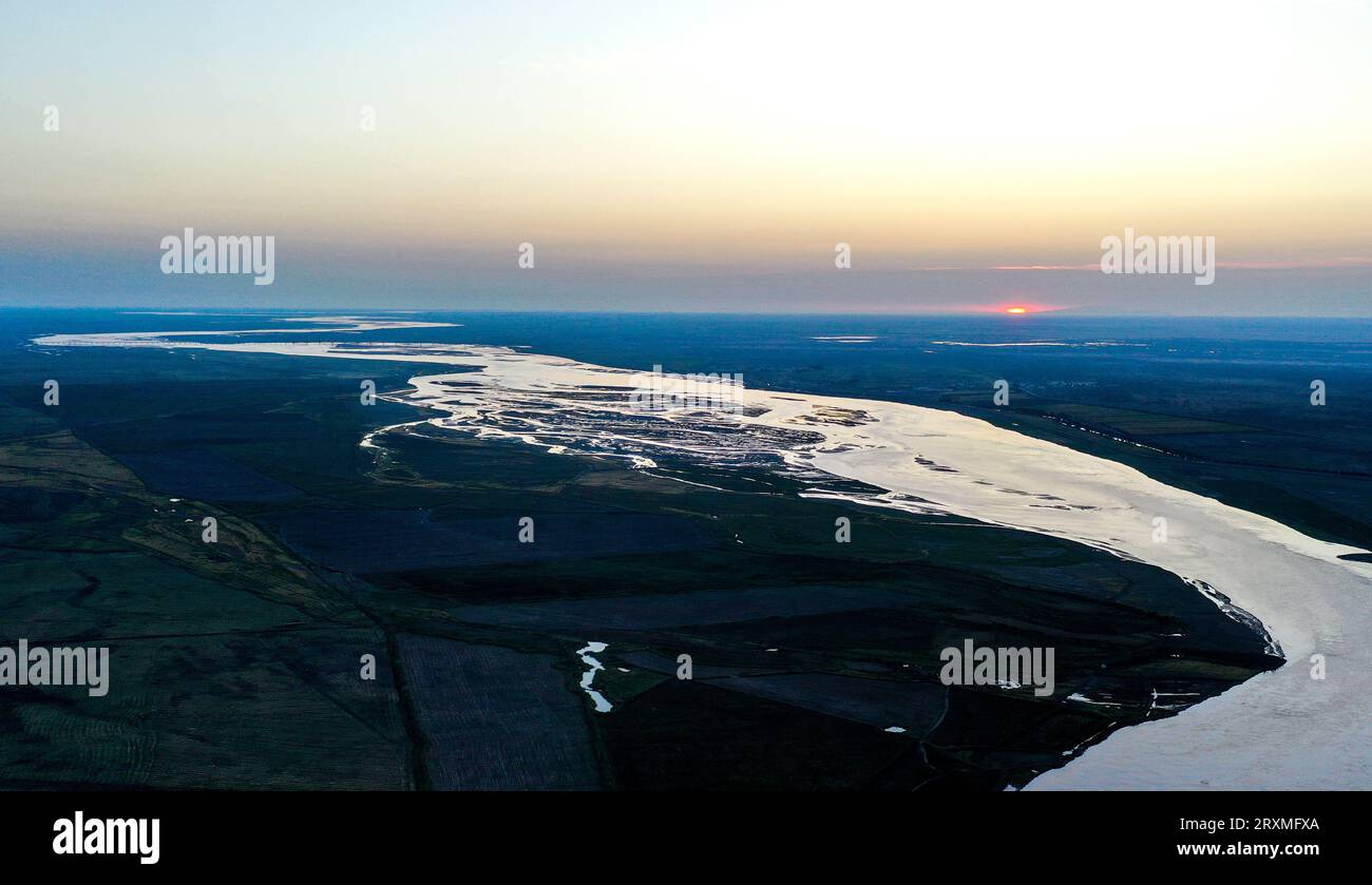 (230926) -- BAYANNUR, Sept. 26, 2023 (Xinhua) -- This aerial photo taken on Sept. 15, 2023 shows a view of the Yellow River in Shuanghe Town of Linhe District in Bayannur, north China's Inner Mongolia Autonomous Region. The Hetao Irrigation Area, located in Bayannur, north China's Inner Mongolia Autonomous Region, has been diverting water from the Yellow River for irrigate since the Qin Dynasty (221 B.C.-206 B.C.). The current irrigation area stands at 11.54 million mu. The 2,200-year-old irrigation project, included in the World Heritage Irrigation Structures in 2019, uses gravity to tra Stock Photo