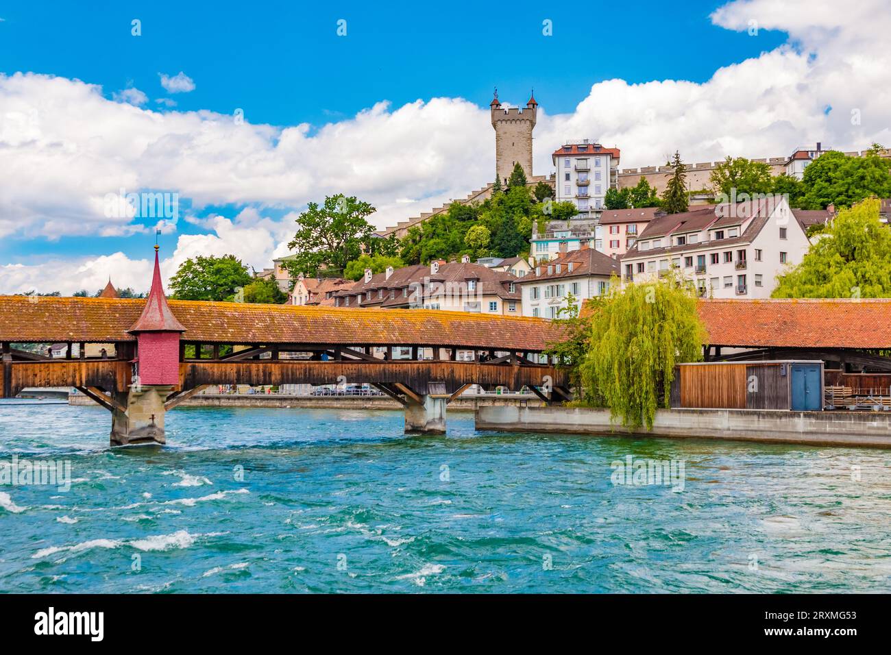 The south wing of Lucerne's Spreuer Bridge with bridge chapel, spanning from the Herrenkeller over the Reuss river to the middle island. In the back... Stock Photo