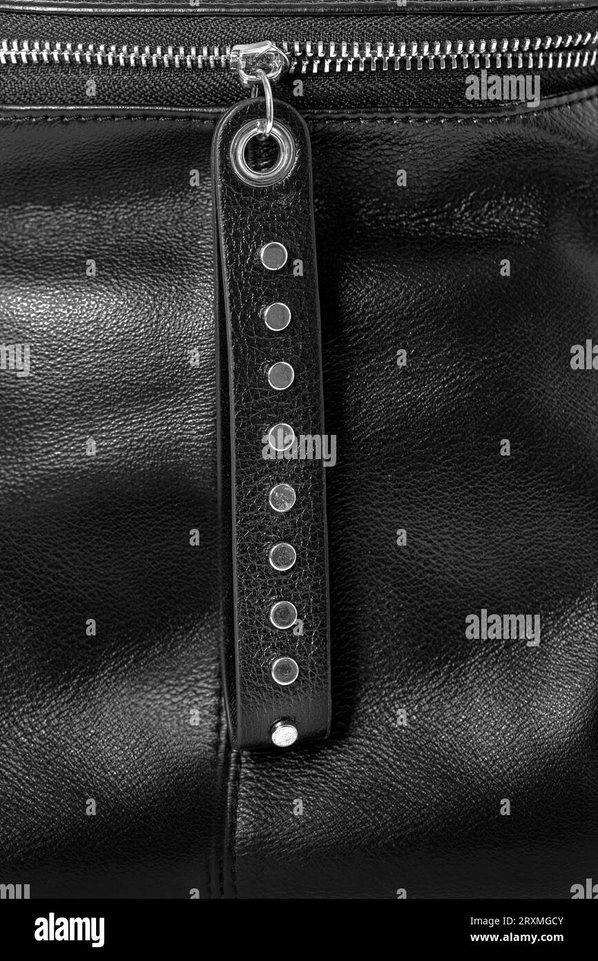 Close up of black leather bag zipper, black leather bag close up Stock Photo