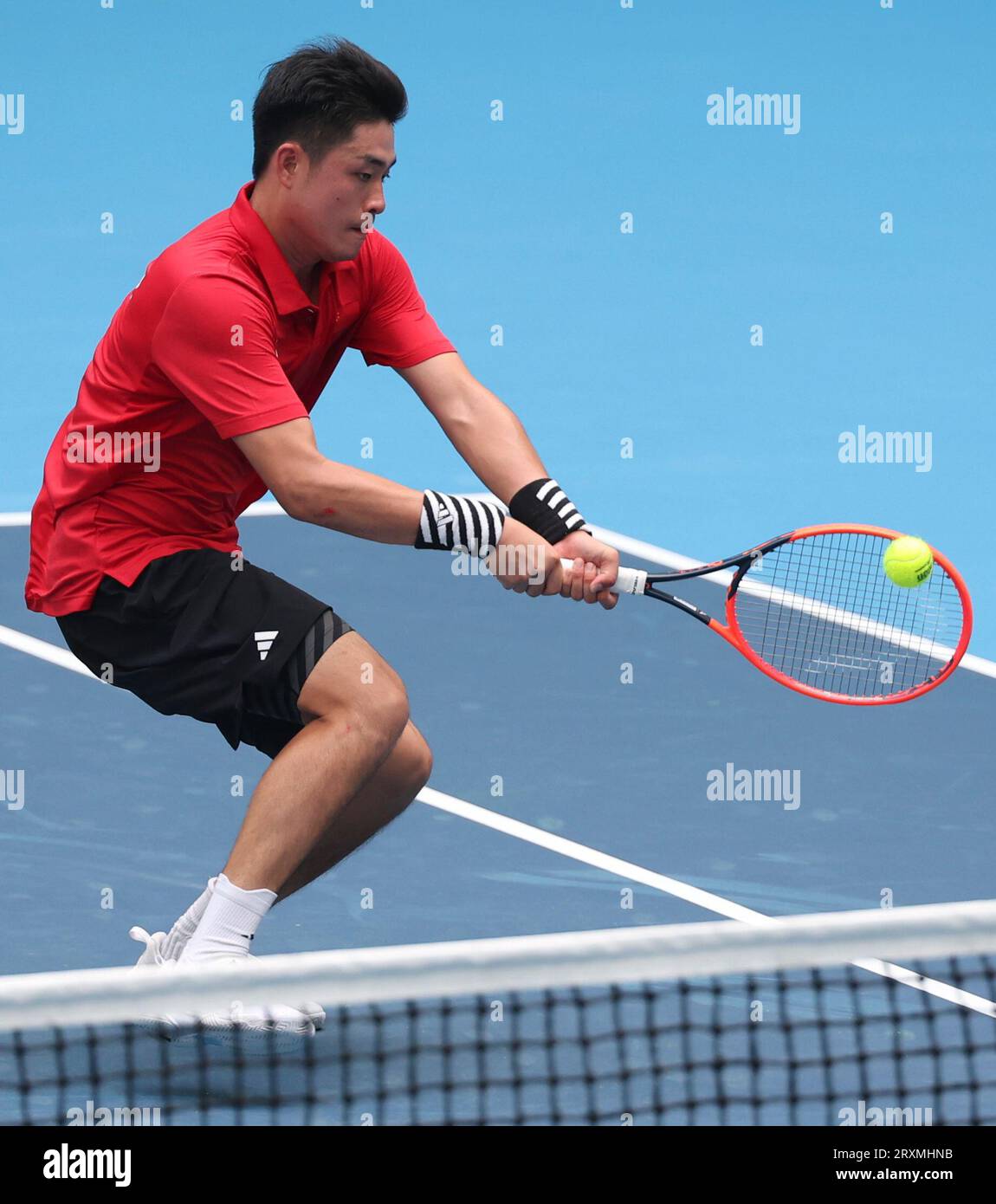 Huang Zelin from Hong Kong is shown returning a shot during a match at the US Open 2025, expressing gratitude to fans for their support.