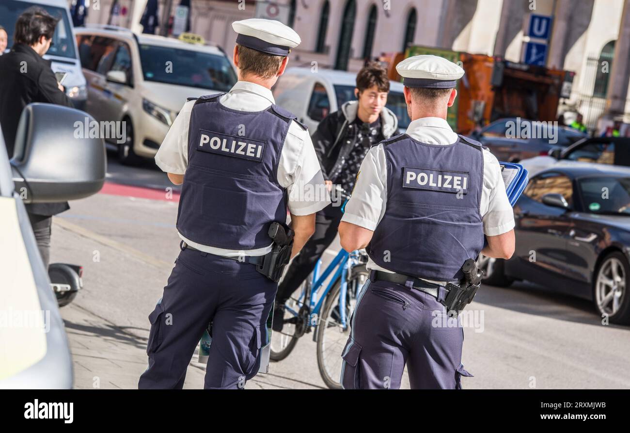 Munich, Bavaria, Germany. 26th Sep, 2023. Under the motto of ''sicher.mobil.leben ''“ RÃ¼cksicht im Blick'' the Bavarian Police joined their counterparts nationwide to carry out a national action for traffic safety with a focus on speeding, cars driving on sidewalks, vehicles parking on cycling paths, dangerous and close overtaking of cyclists. In the case of the latter, cyclists have complained in Munich that the paths are mostly being used as parking spots for scofflaws and adding more without a safety plan essentially adds more unsafe bicycle paths that will also be used as parking lots Stock Photo