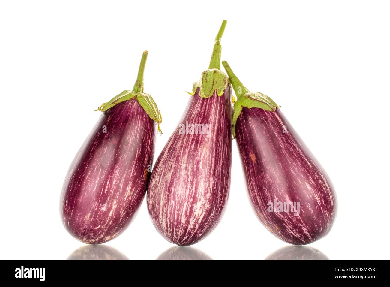 Three organic ripe eggplants, macro, isolated on white background. Stock Photo