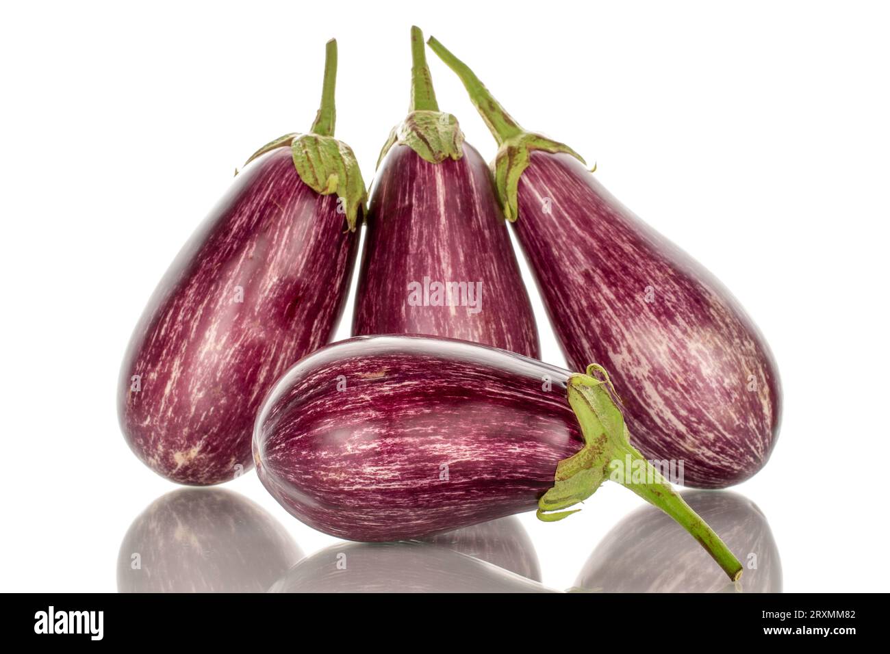Four organic ripe eggplants, macro, isolated on white background Stock
